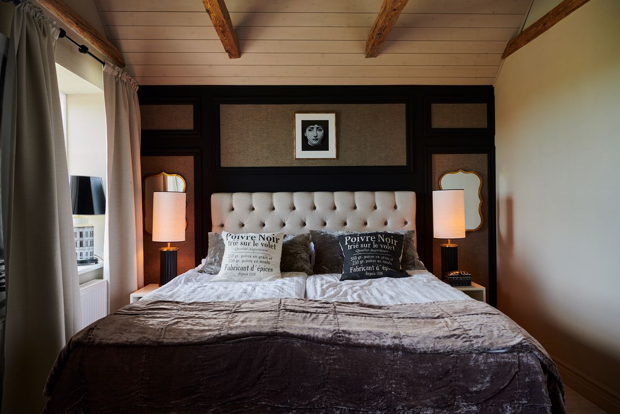 bedroom with rustic chic decorative beams