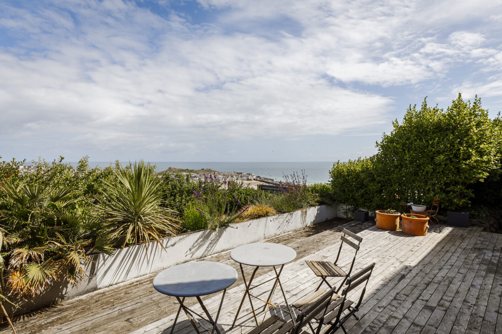 wooden terrace with a view of the sea