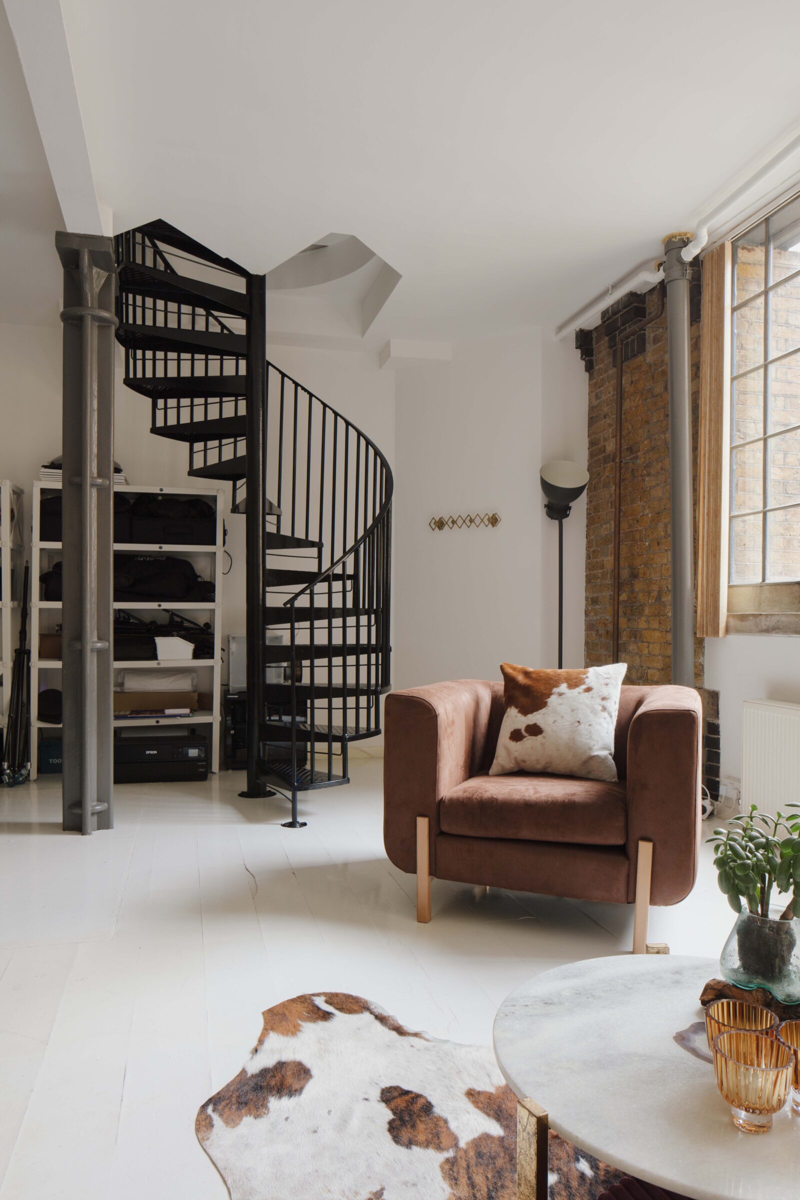 London loft living room with metal staircase
