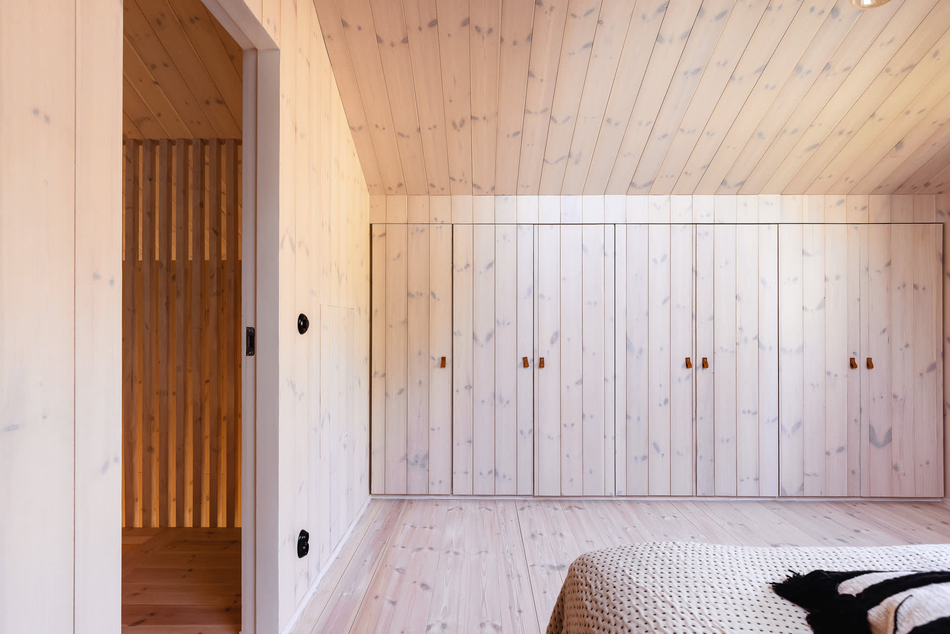 bedroom in the attic with built-in wardrobes