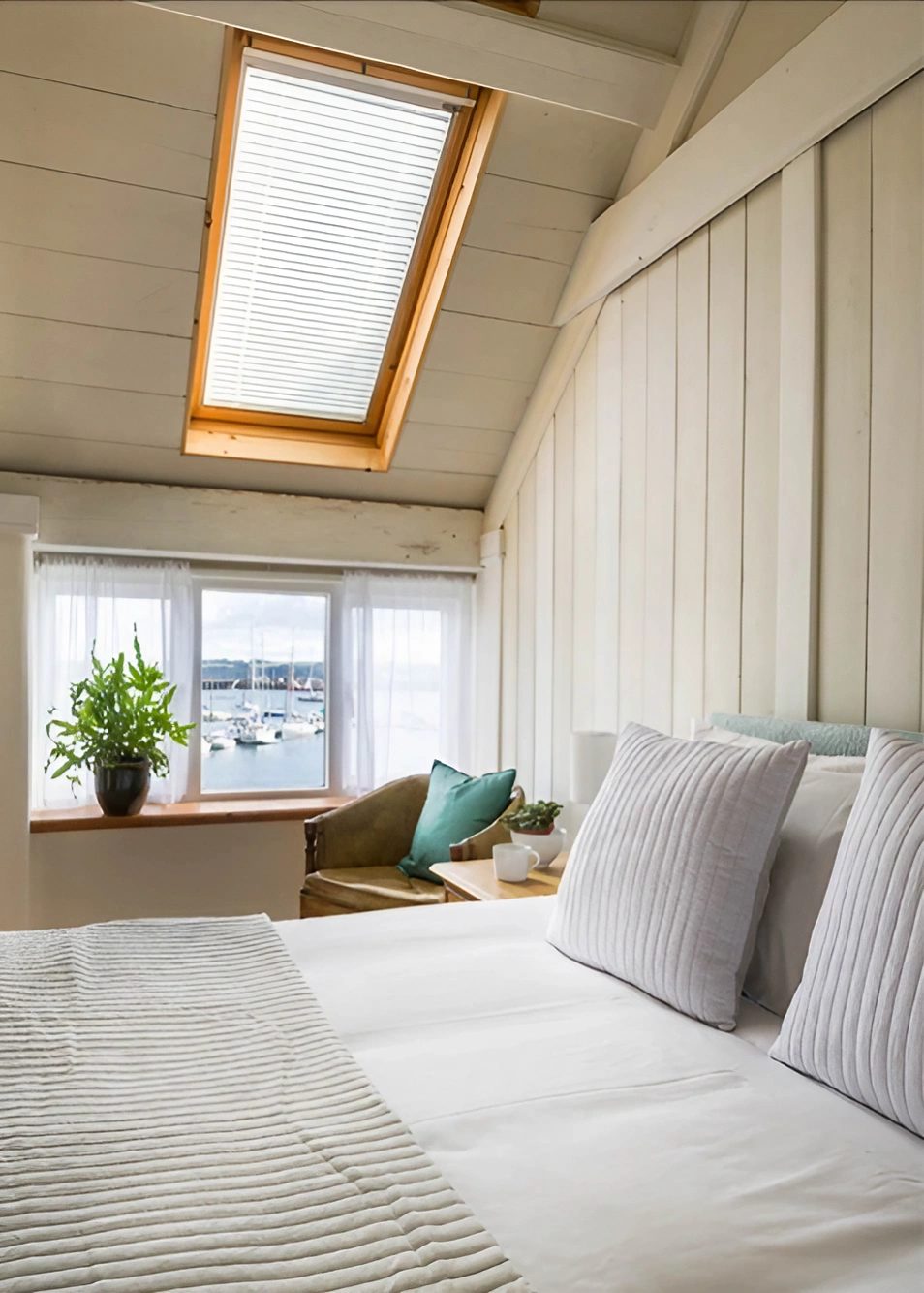 Upstairs bedroom with English cottage roof window